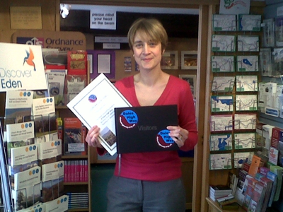 Nicola, manager of Appleby TIC with the new Dales High Way Guestbook and Certificate